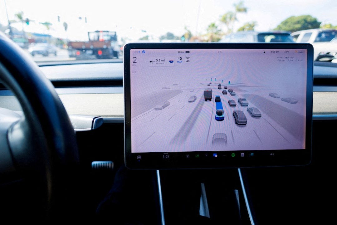 Tesla launches free trial of assisted driving service in China | Reuters