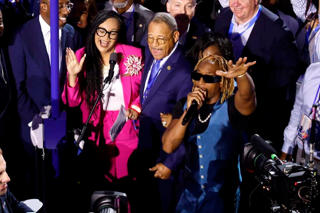 Rapper Lil Jon (right) performs with the Georgia delegation during the Ceremonial Roll Call of States on the second day of the Democratic National Convention at the United Center on Tuesday in Chicago. 