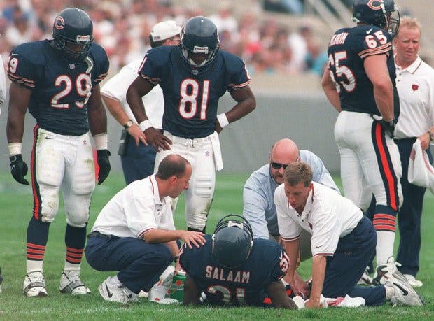 Chicago Bears' Rashaan Salaam (31) is examined after a leg...