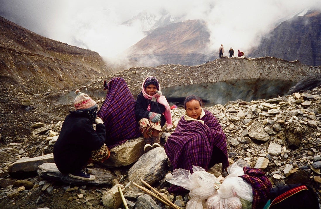 A group of people sitting on rocks

AI-generated content may be incorrect.