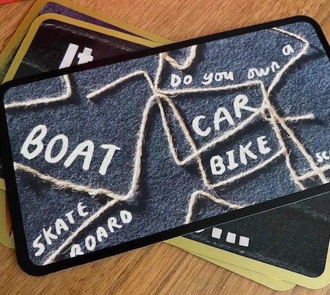Picture of a card with the words boat, car, bike, scooter and skateboard.
