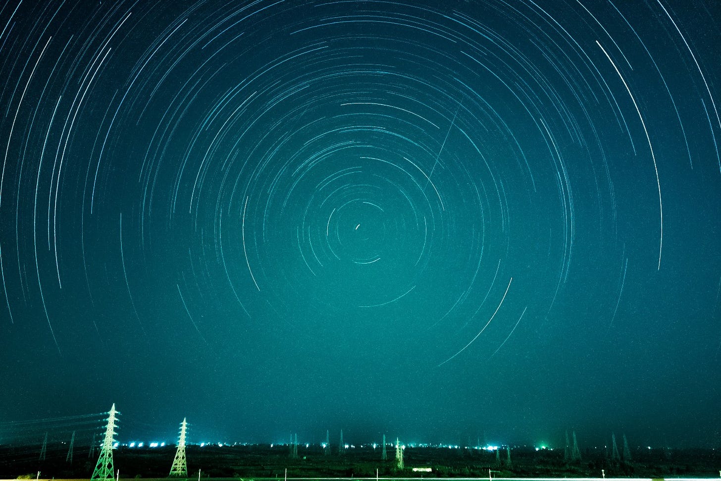 time-lapse photo of stars spinning in the night sky