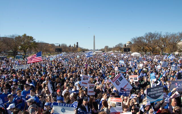Participants hold up signs at the March for Israel rally organized by the Jewish Federations of North America on November 14, 2023 on the National Mall in Washington. (Daryl Perry)
