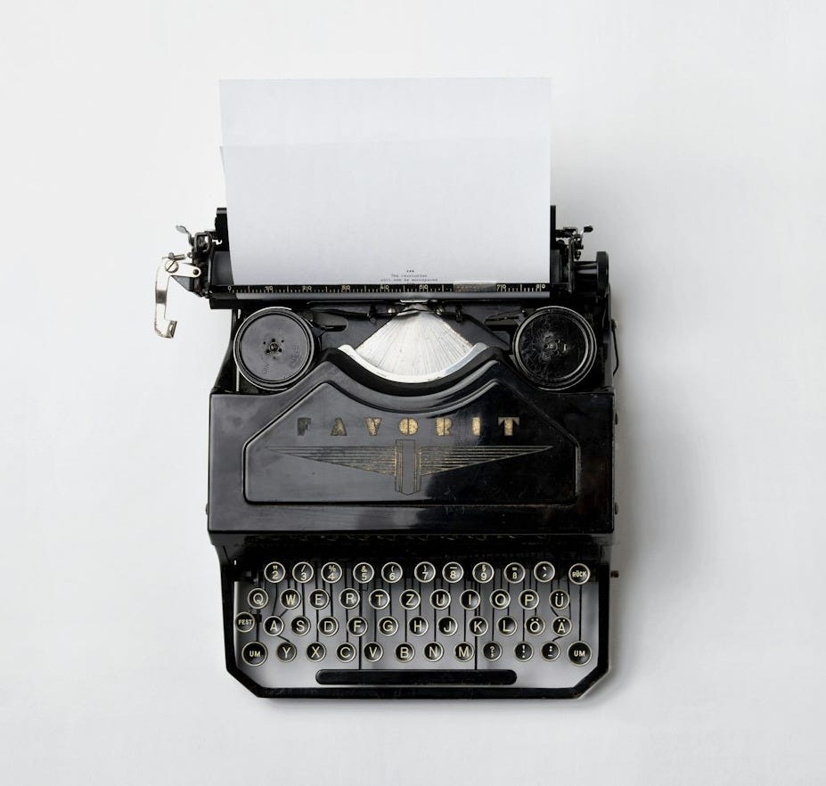 black Fayorit typewriter with printer paper black Fayorit typewriter with printer paper