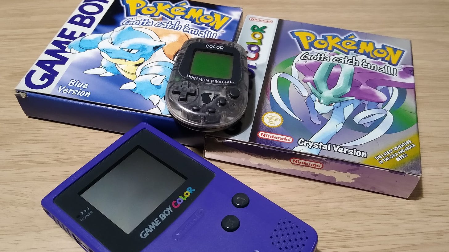 My original Game Boy Color, Pokémon Crystal, Pocket Pikachu Color, and Pokémon Blue