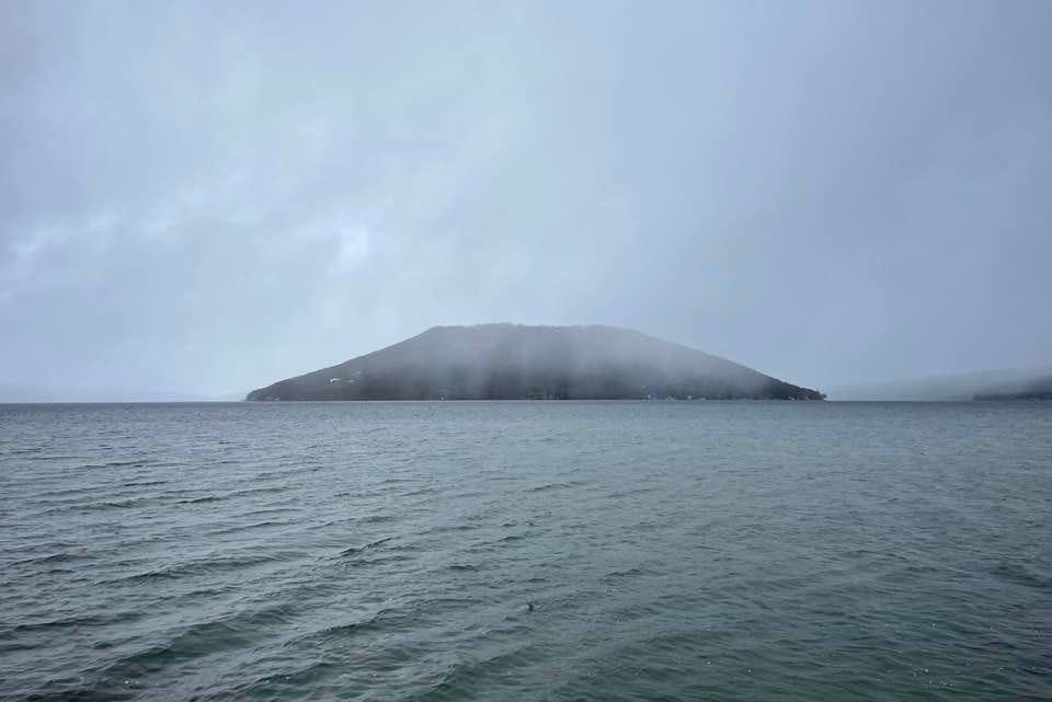 May be an image of fog, ocean and twilight