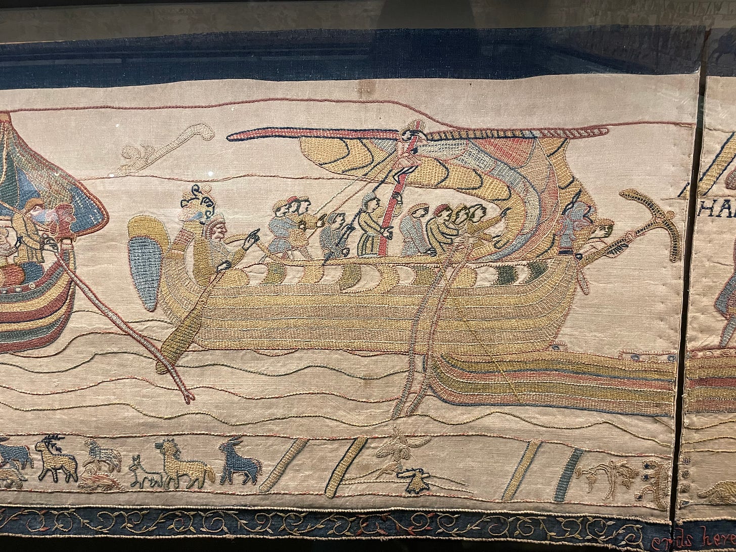 Embroidery on linen showing a boatload of Norman soldiers