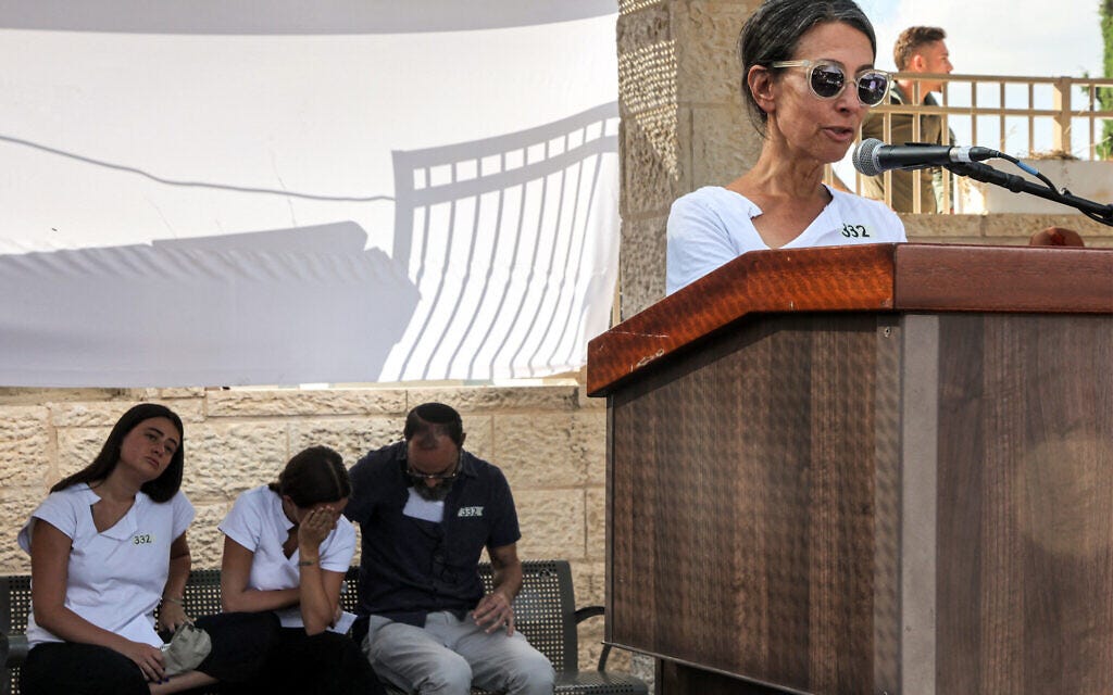 Rachel Goldberg-Polin, mother of Hersh Goldberg-Polin whose body was recovered with five other hostages after they were murdered by Hamas in Gaza, speaks during his funeral in Jerusalem on September 2, 2024. Her husband and daughters are seated behind her. (Gil Cohen-Magen / Pool / AFP)