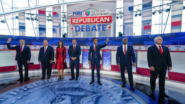 A photo depicts Republican presidential candidates, from left, North Dakota Gov. Doug Burgum, former New Jersey Gov. Chris Christie, former U.N. Ambassador Nikki Haley, Florida Gov. Ron DeSantis, entrepreneur Vivek Ramaswamy, Sen. Tim Scott, R-S.C., and former Vice President Mike Pence, at a debate hosted by FOX Business and Univision, Wednesday at the Ronald Reagan Presidential Library in Simi Valley, Calif.