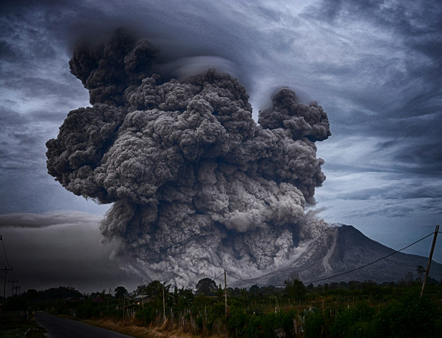 A volcanic eruption with ash cloud rising from caldera A volcanic eruption with ash cloud rising from caldera
