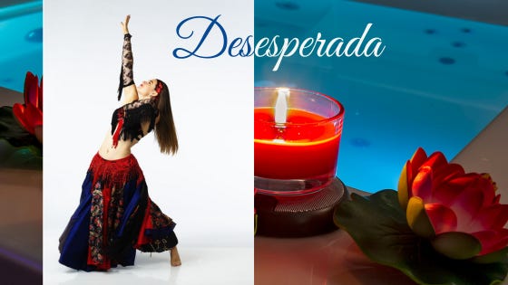 Desesperada: in the foreground, the author in a red, black and blue belly dance costume, hand thrust up in a dramatic pose. In the background, a red candle glows at the edge of a bathtub decorated with red lotuses