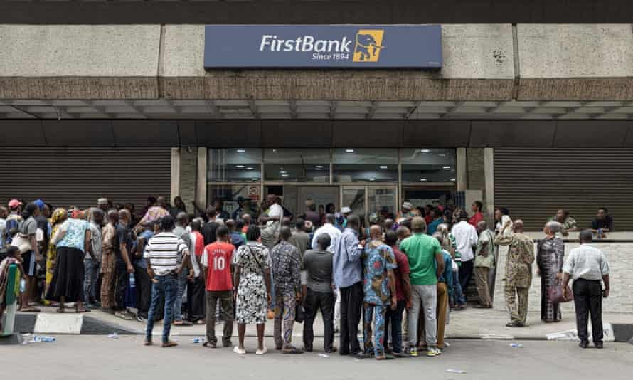 Crowds form outside a bank in Lagos