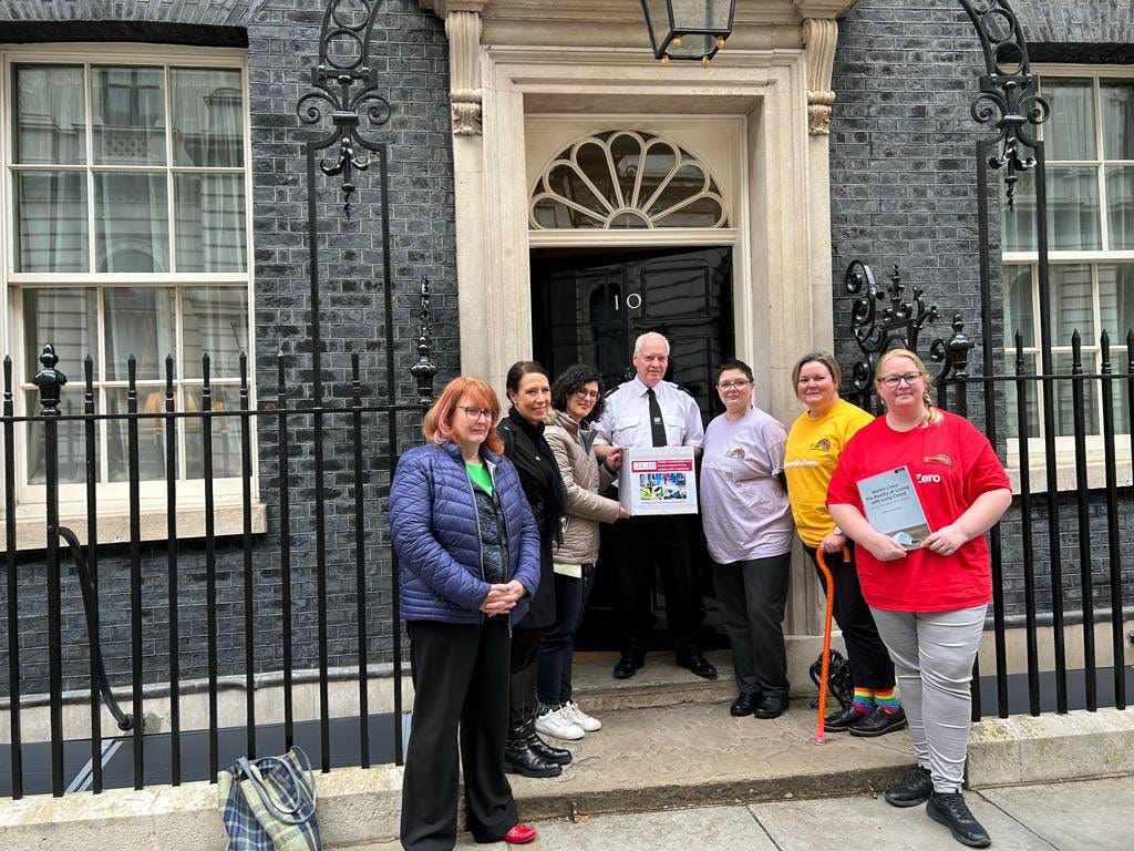 Key worker petition team outside of 10 Downing Street with Laila Moran handing the 130000 signed petition