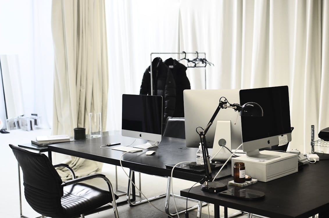 Free Workspace with modern convenient computers in daytime Stock Photo