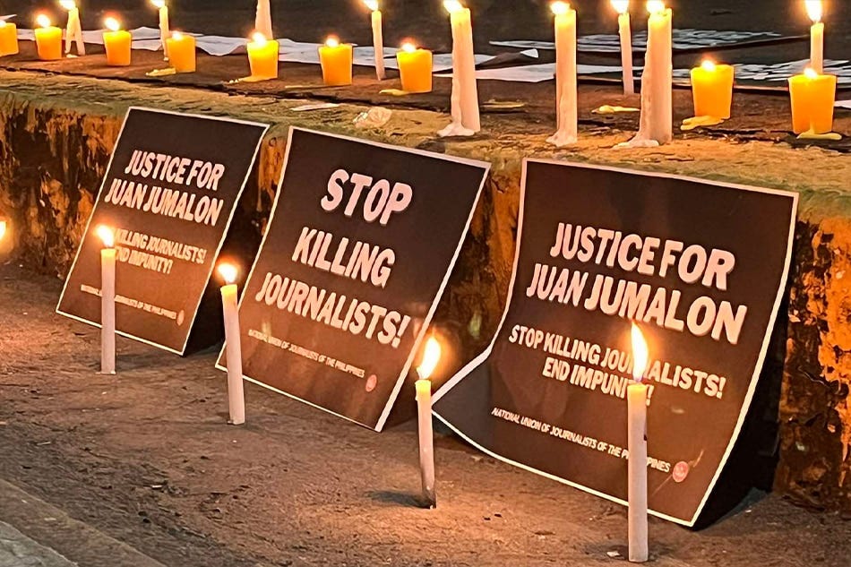 Groups condemn the slaying of Juan Jumalon in a candle-lighting at the Commission on Human Rights in Quezon City. Addie Cuadra.