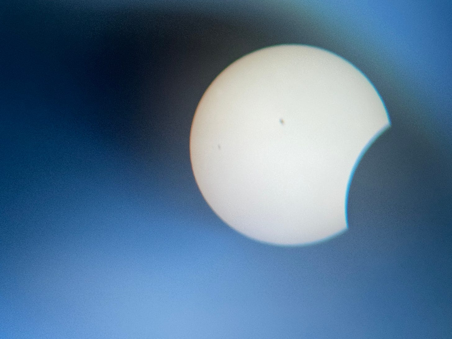 ArmaniXR’s photo of the Sun through solar binoculars as it is beginning to be occluded by the Moon