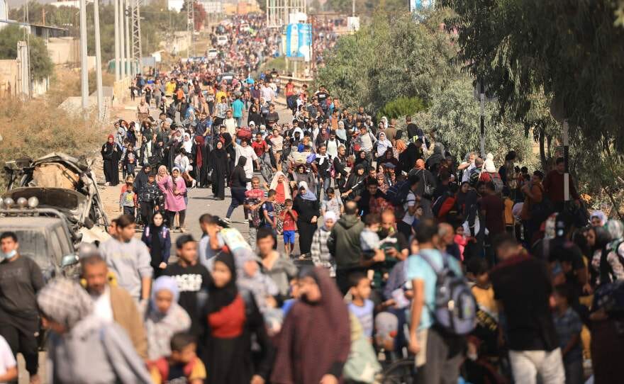 Thurs., Nov. 9: Palestinians families fleeing Gaza City and other parts of northern Gaza towards the southern areas, walk along a highway.