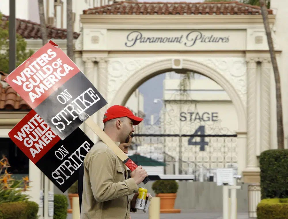 FILE - Striking film and television writers picket outside Paramount Studios on Jan. 23, 2008, in Los Angeles. In an email to members Monday, April 17, 2023, leaders of the Writers Guild of America said nearly 98% of voters said yes to a strike authorization if a new contract agreement is not reached with producers. The guild last went on strike in 2007. (AP Photo/Kevork Djansezian, File)