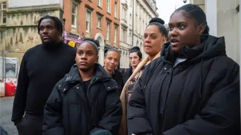 PA Media/Ben Birchall A group of people standing outside Bristol Crown Court