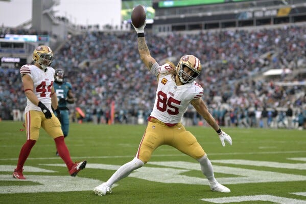 San Francisco 49ers tight end George Kittle (85) celebrates after scoring a touchdown during the second half of an NFL football game against the Jacksonville Jaguars, Sunday, Nov. 12, 2023, in Jacksonville, Fla. (AP Photo/Phelan M. Ebenhack)