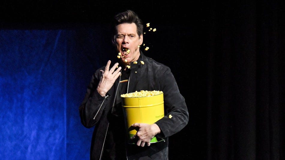 Jim Carey throwing popcorn at CinemaCon for Sonic movie.