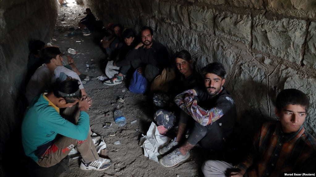 Afghan migrants hide from security forces in a tunnel under train tracks after crossing illegally into Turkey from Iran on August 23, 2021 -- days after the Taliban seized power in Afghanistan. 