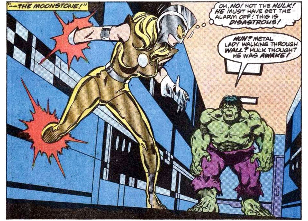 A panel from this issue showing Moonstone walking through a wall and running into Hulk. Caption reads “‘— the Moonstone!’” Moonstone thinks, “Oh, no! Not the Hulk! He must have set the alarm off! This is disastrous!” Hulk says, “Huh? Metal lady walking through wall? Hulk thought he was awake!”