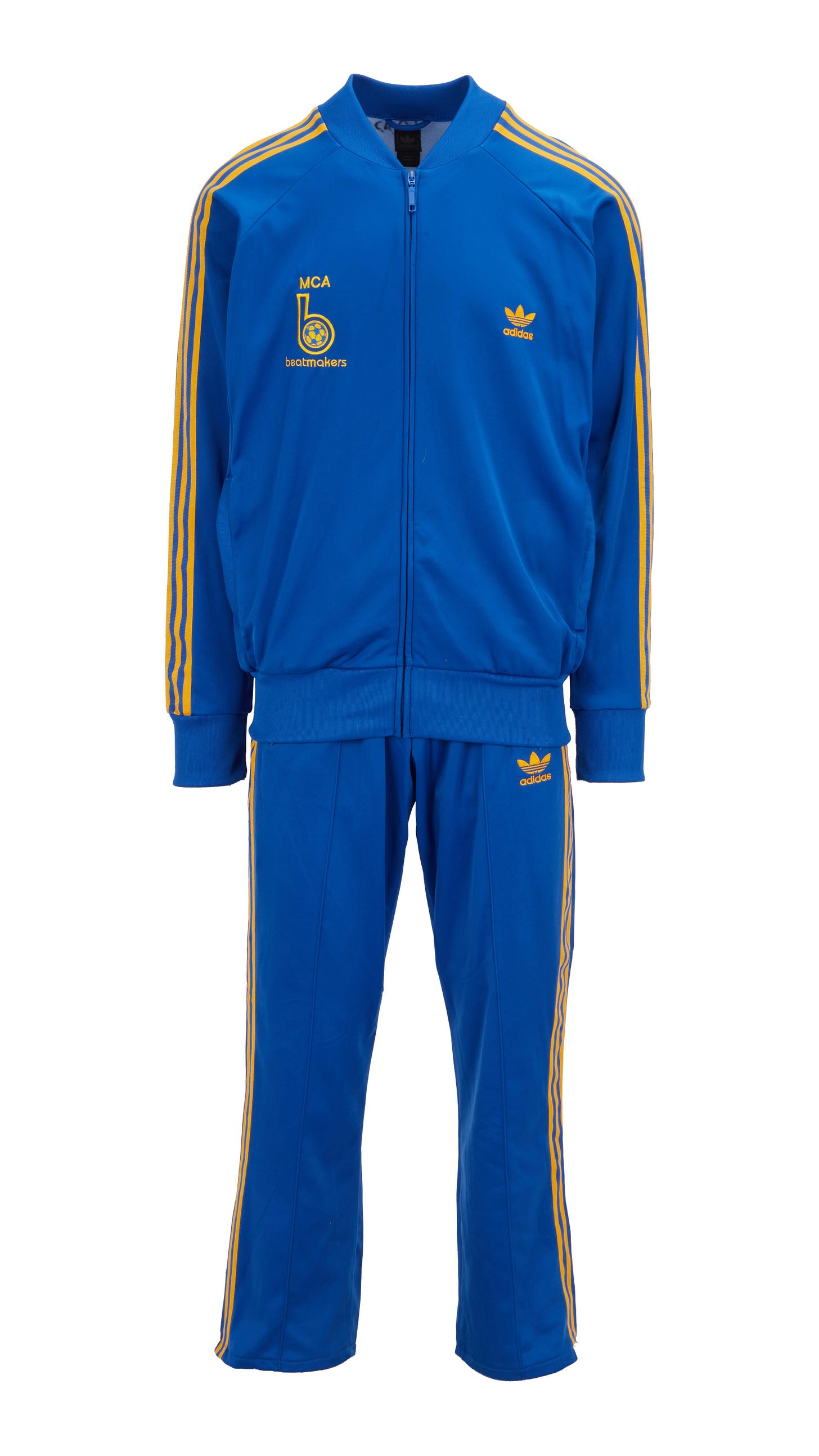 a blue adidas tracksuit with yellow stripes on the sleeves