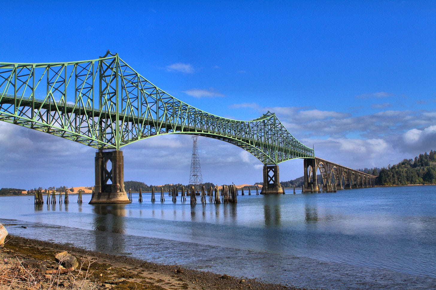 A cantilever bridge over a still bay