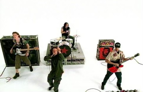 Screen capture of Rage Against The Machine's video for Guerrilla Radio, featuring the band performing in a stark white space.