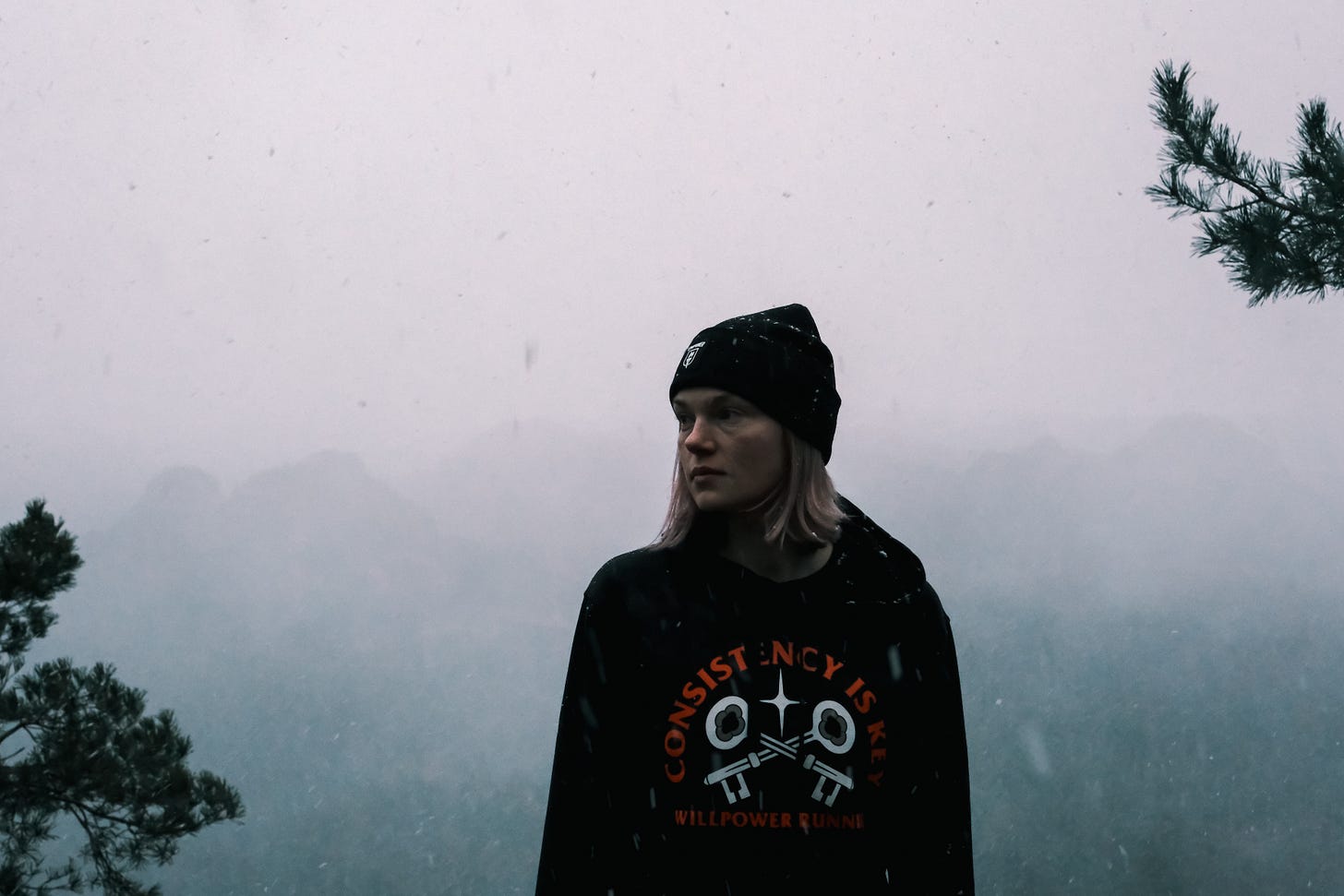 Female runner wearing a hoodie in winter