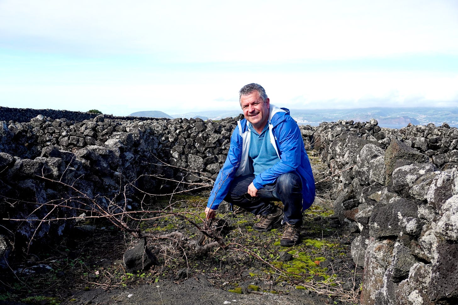 Fortunato in his vineyards, Pico island. Photo (C) Simon J Woolf