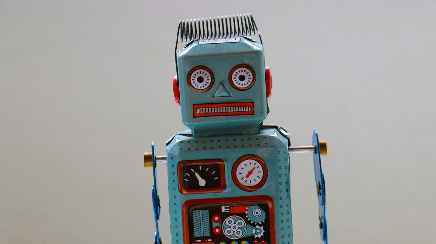 Metal robot with round eyes and a grimace Metal robot with round eyes and a grimace