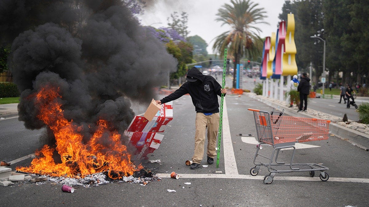fire in street in anti-ICE protest in LA fire in street in anti-ICE protest in LA