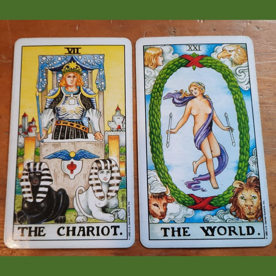 A photo of 2 tarot cards lying side by side - The Chariot and The World