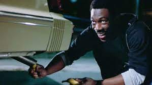 Eddie Murphy putting a banana in the tailpipe of a car