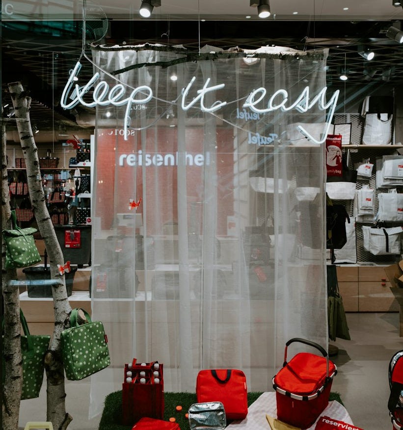 red bags and basket on display