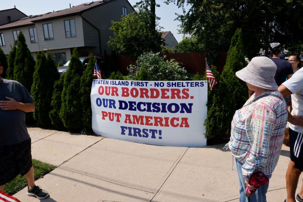 A sign protesting the migrant shelter at the Midland Beach Senior Citizens Center on Staten Island.