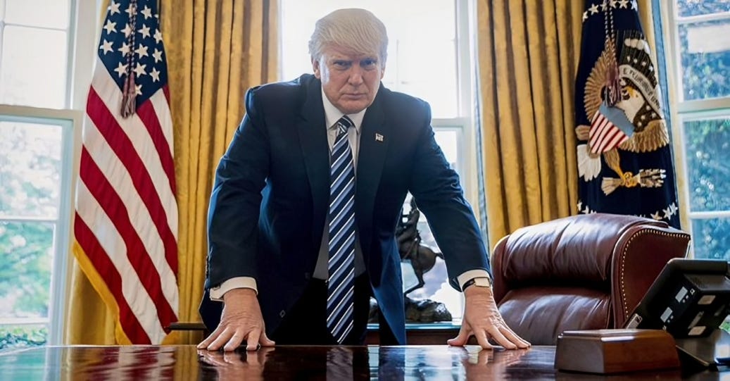 Donald Trump standing assertively at the Oval Office desk, showing a determined expression, with the American flag and presidential seal in the background.