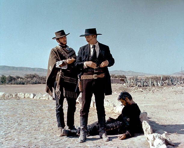 American actors Clint Eastwood, Lee Van Cleef and Italian Gian Maria Volonte on the set of For a Few Dollars More (Per qualche dollaro in più), written and directed by Sergio Leone. (Photo by United Artists/Sunset Boulevard/Corbis via Getty Images)