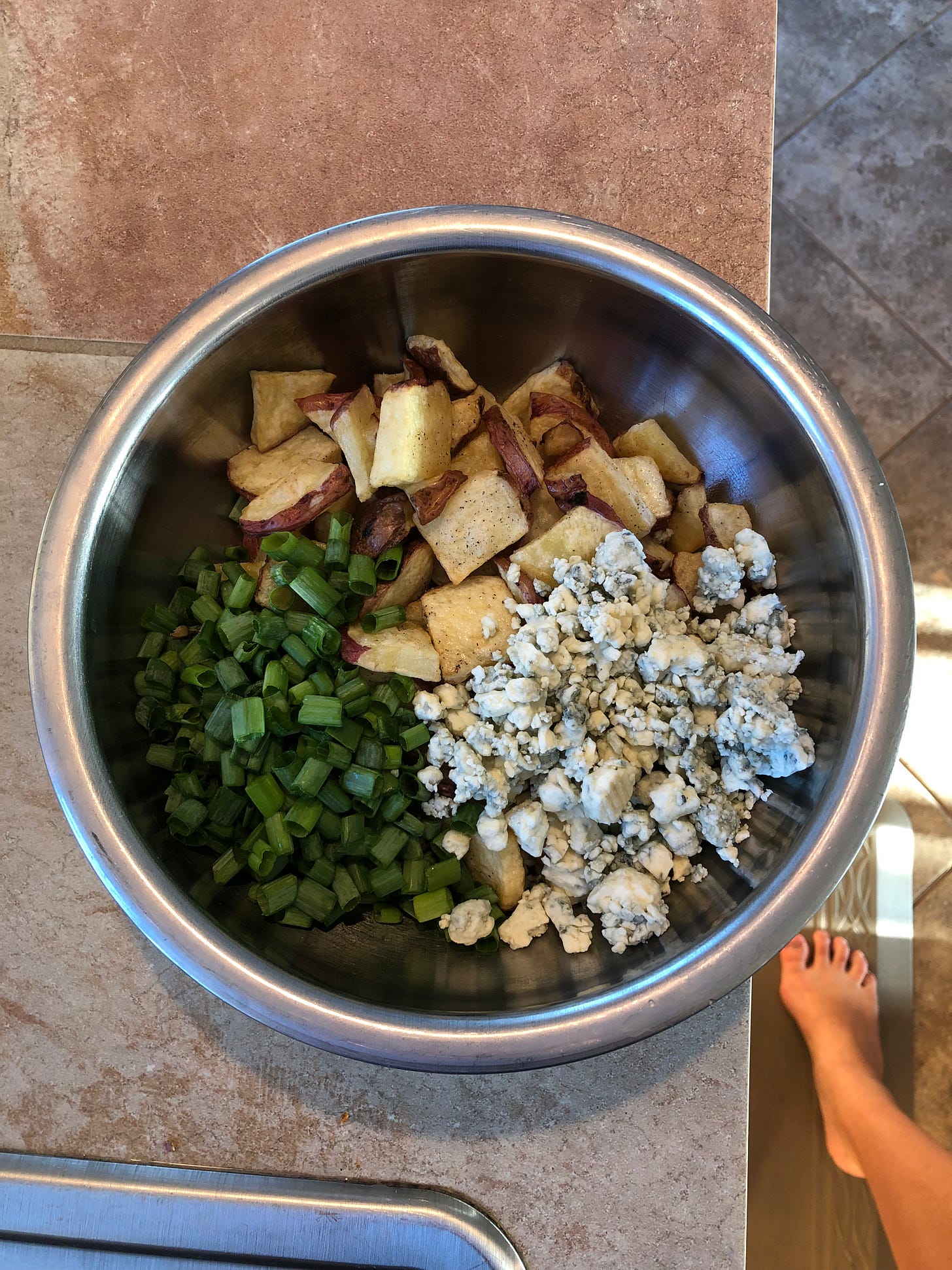 roasted potatoes with green onions and crumbly cheese