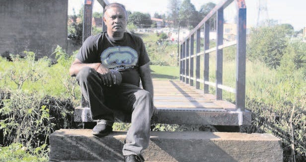 Sanjay Sewrathan on the bridge that he and his cousin Rakesh Ramkarin repaired hours before Ramkaran died of a heart attack. Photo: Nqubeko Mbhele
