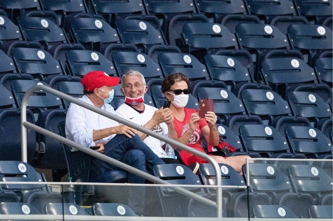 Dr. Anthony Fauci in the stands without a mask on.