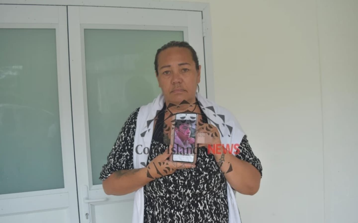 Mary Kerehoma shows the picture of 15-year-old son Drazei Kerehoma who died unexpectedly in his sleep in Rarotonga last week. Photo / Cook Islands News
