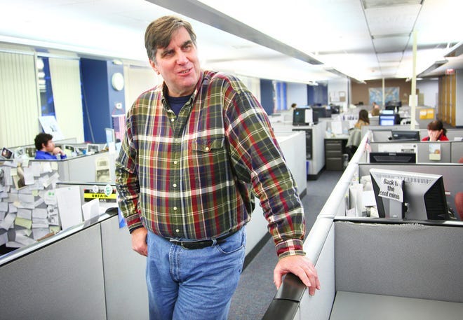 Fred Hanson, shown in the newsroom of The Patriot Ledger in 2015, died Monday, April 8, 2024, after suffering a medical emergency at Braintree Town Hall. He was 67.