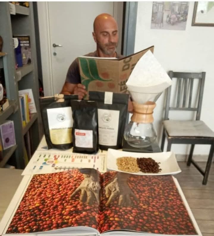 May be an image of 1 person, coffee cup, coffee maker and text