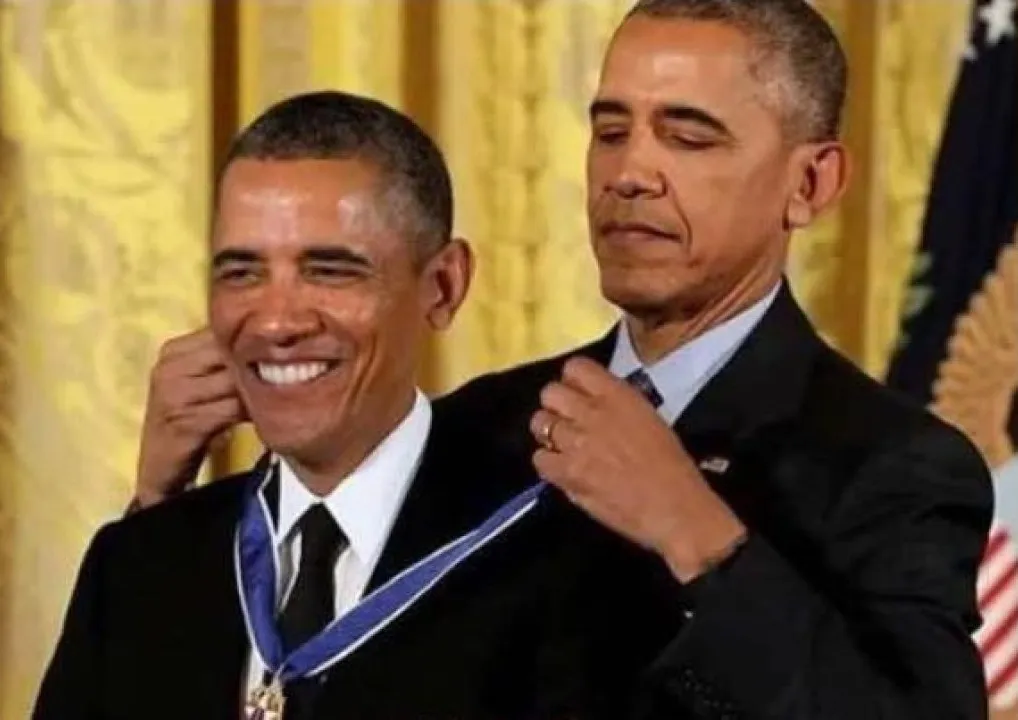 A photoshopped image in which Barack Obama appears to be awarding a clone of himself with a medal. A photoshopped image in which Barack Obama appears to be awarding a clone of himself with a medal.