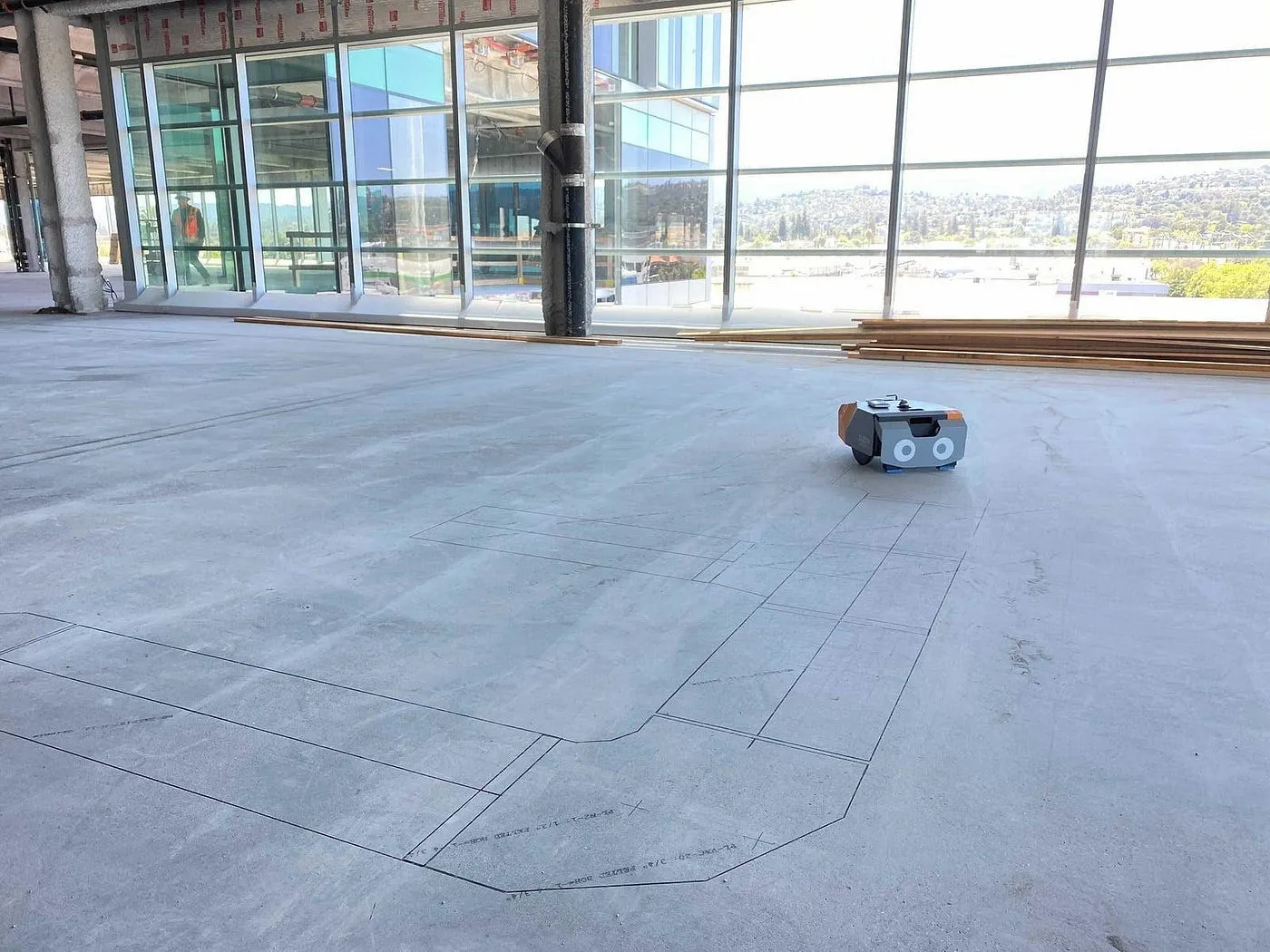 Dusty Robotics Fieldprinter performing automated layout on a construction site