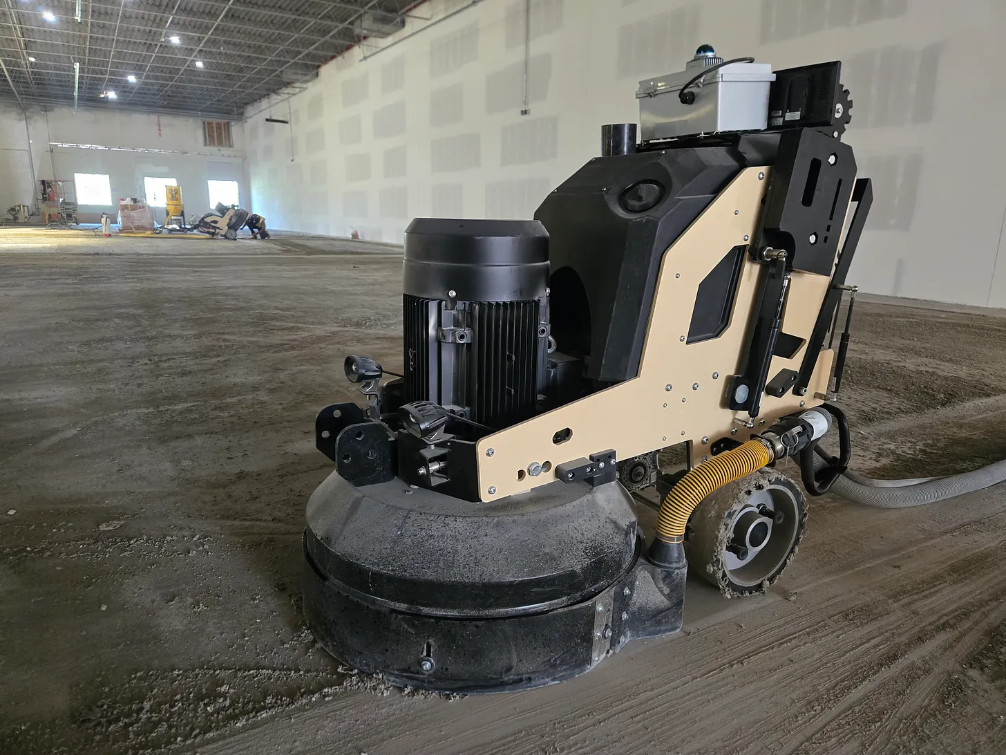 Tempo Works concrete grinding robots working autonomously in a large warehouse facility