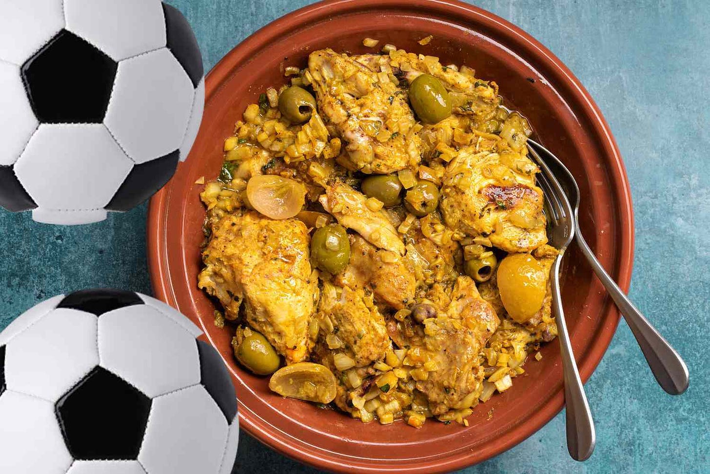 This is the tajine with lemons and olives, not apricots. It is not traditionally served with soccer balls. I added those to make it an “altered for creative purposes” image so the cookbook publisher I stole the rest of the picture from can’t sue me. I considered photoshopping in some apricots too, but my lawyer and my culinary consultant both advised against it.